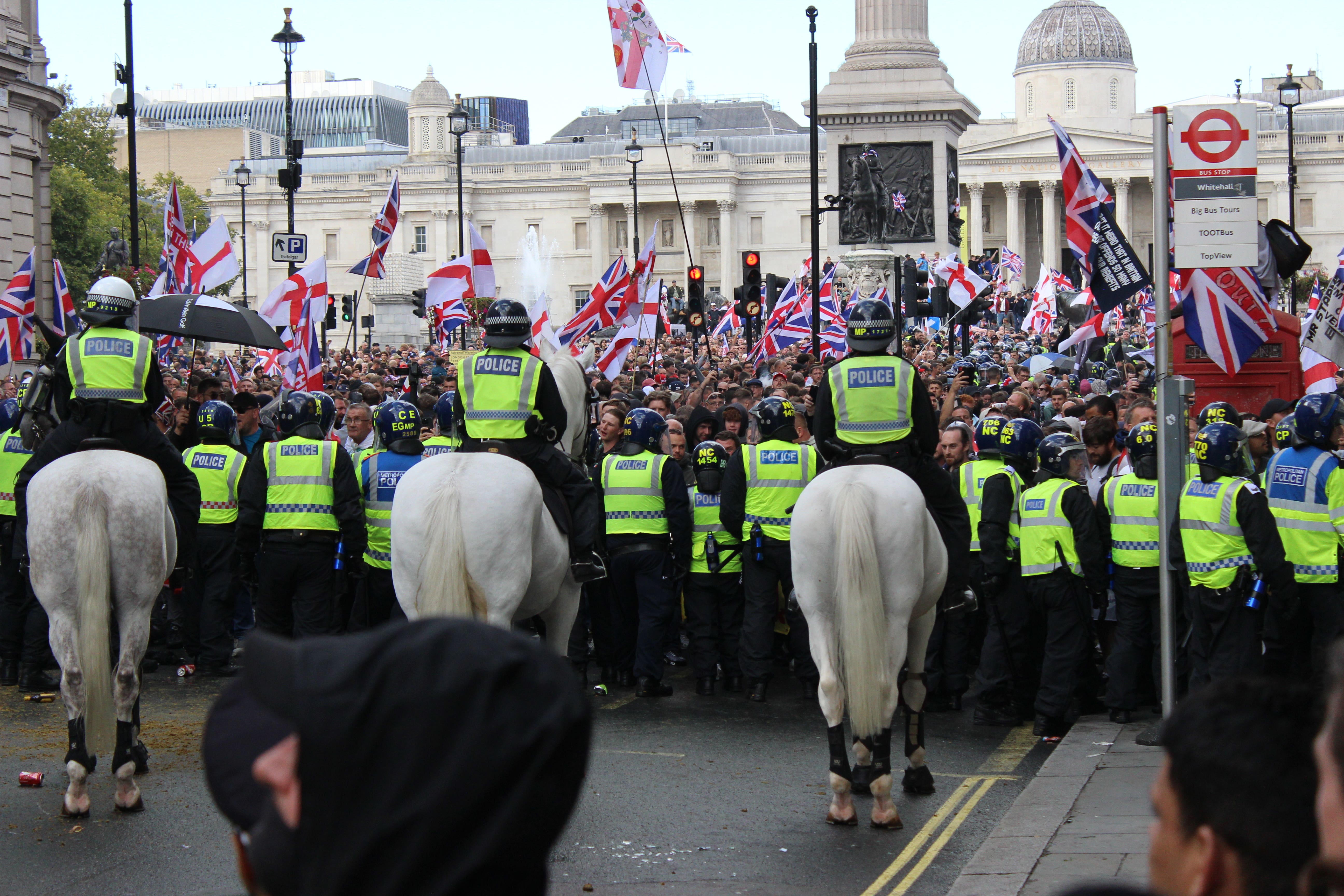 Police push back protesters taking part in the Unite the Kingdom march and rally in central London (Pol Allingham/PA)