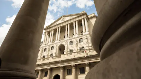 Getty Images External shot of the Bank of England building taken from a low view with pillars either side in the foreground.