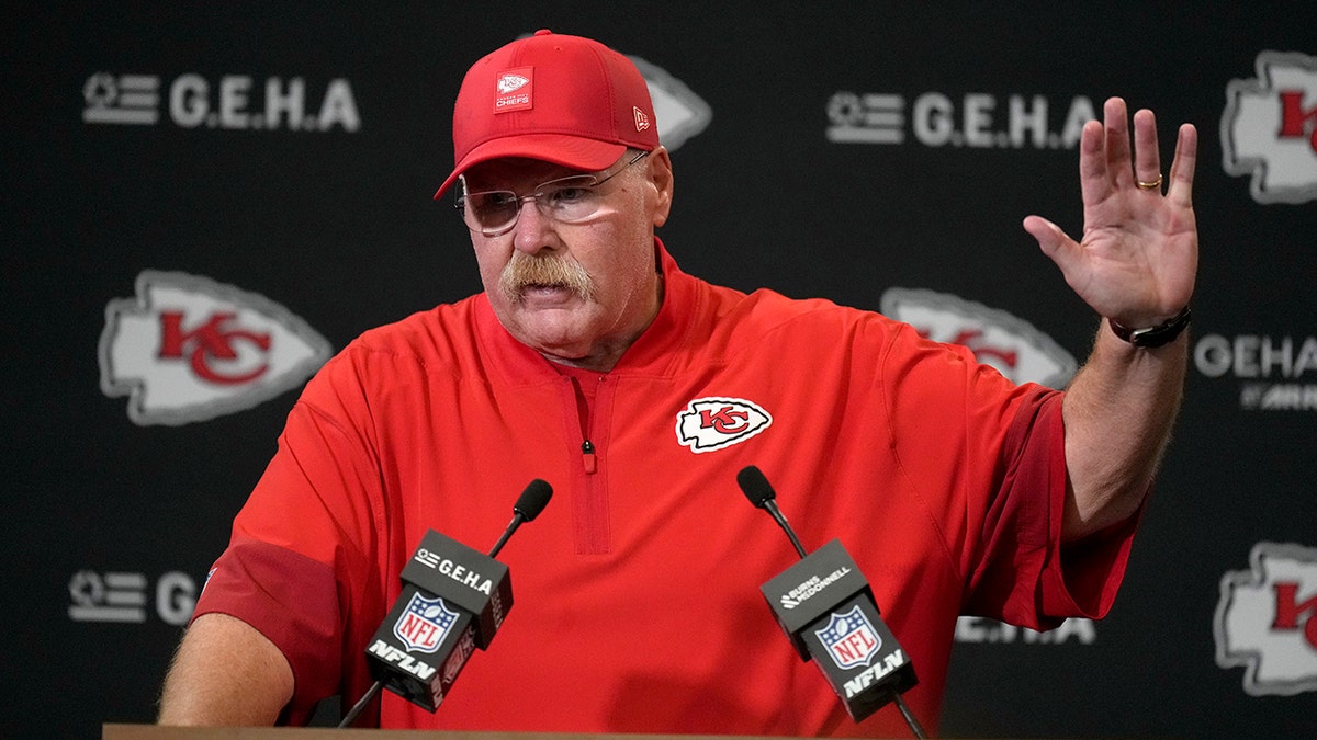 Andy Reid talks to reporters
