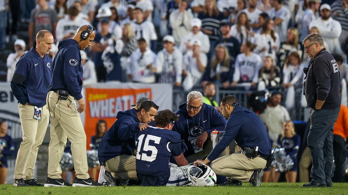 Drew Allar sits up on the football field