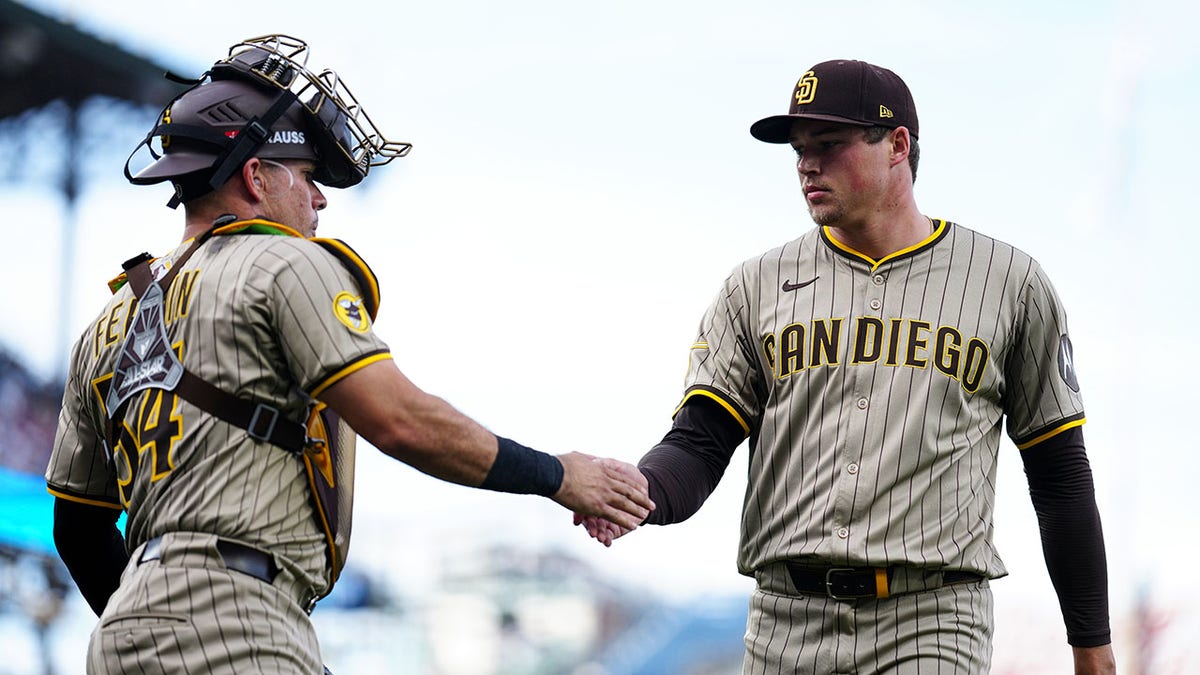 Mason Miller shakes Freddy Fermin's hand