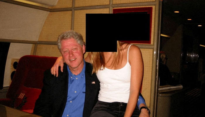 Former US President Bill Clinton and a woman are seen in this image from the estate of late financier and convicted sex offender Jeffrey Epstein, released by the Department of Justice in Washington, DC, US, on December 19, 2025. — Reuters